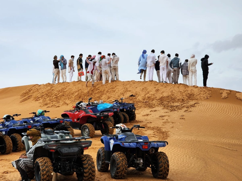 Group photo of tourists after Merzouga quad biking adventure