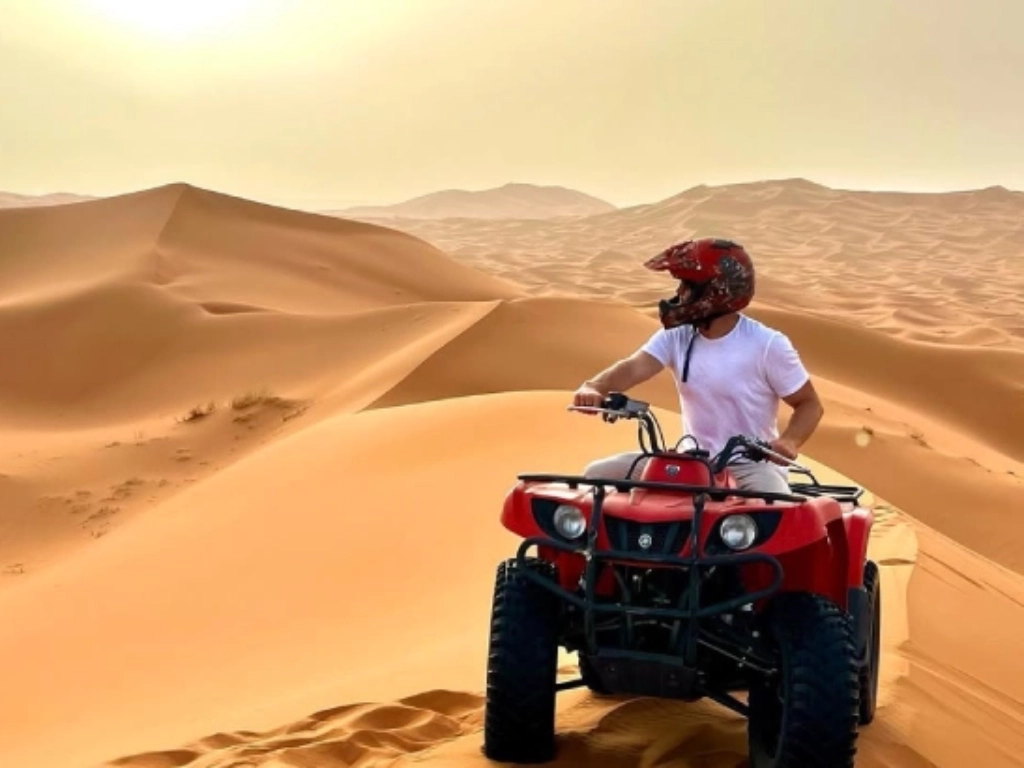 Male tourist reviewing Merzouga ATV quad biking experience