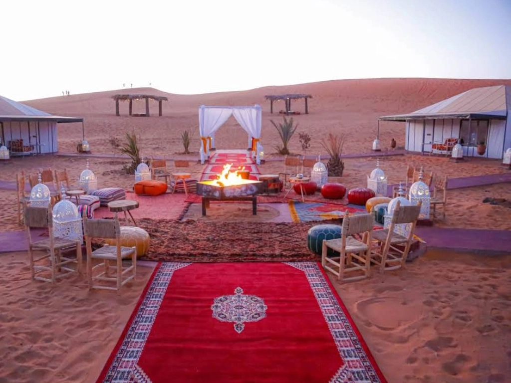 Luxury desert camp in Merzouga with elegant tents and comfortable furnishings