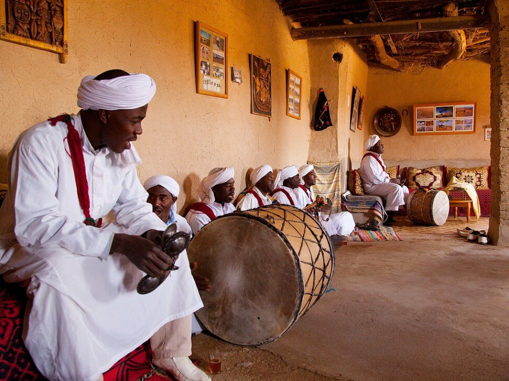 Tourists enjoying Gnawa music performance in Khamlia village
