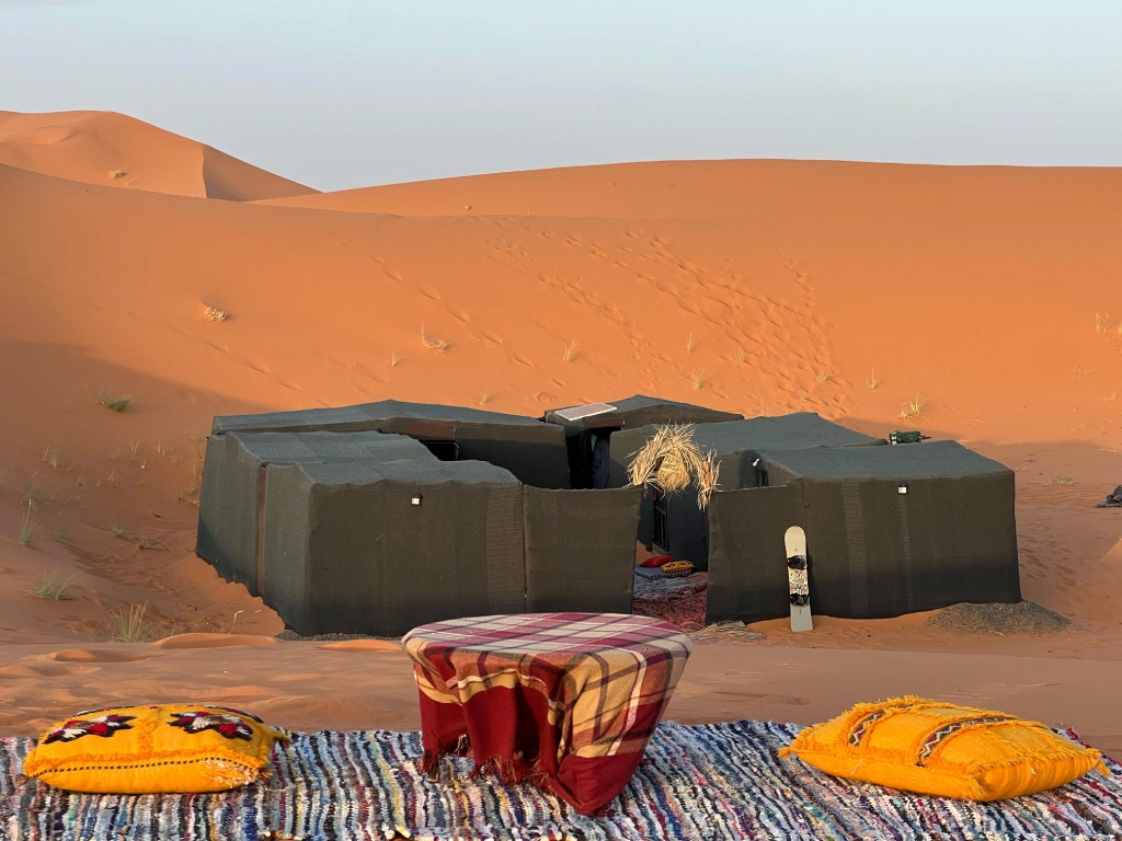 Traditional Berber desert camp with tents arranged in a circle in Merzouga