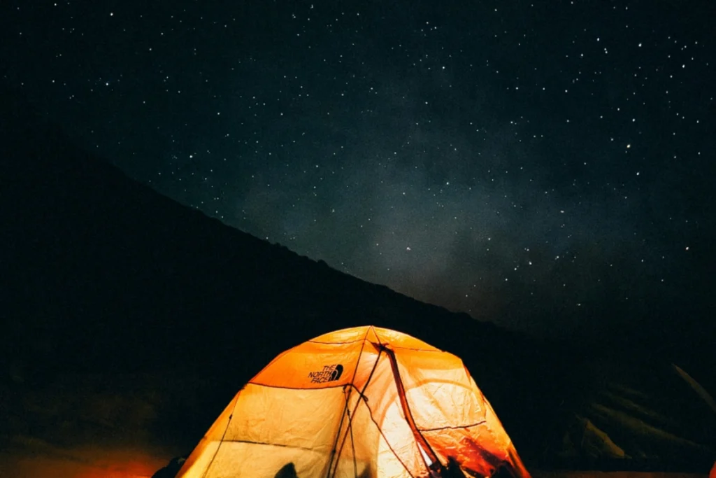 Starry night sky over Merzouga desert camp showing the Milky Way for wild camping Morocco experience