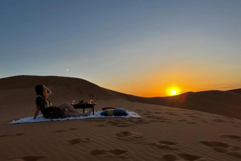 Sunrise over Erg Chebbi dunes from a wild camping Morocco site